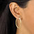 Diamond-Cut Twisted Hoop Earrings in 10k Yellow Gold (1 3/8")-13 at PalmBeach Jewelry